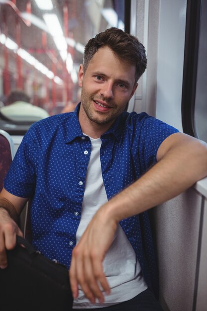 Portrait of man traveling in train