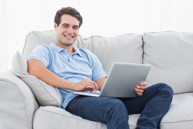 Portrait of a man using his laptop