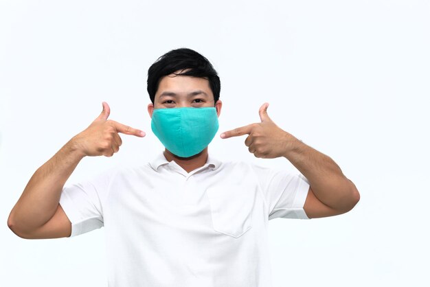 Portrait of man wear protect mask on white backgroundWearing face mask for prevent COVID19 Pandemic Coronavirusworker with medical mask for against and stop coronavirus