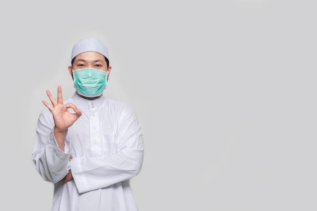 Portrait of man wear protect mask on white backgroundWearing face mask for prevent COVID19 Pandemic Coronavirusworker with medical mask for against and stop coronavirus