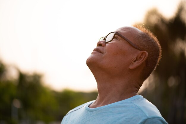 Portrait of man wearing eyeglasses against sky