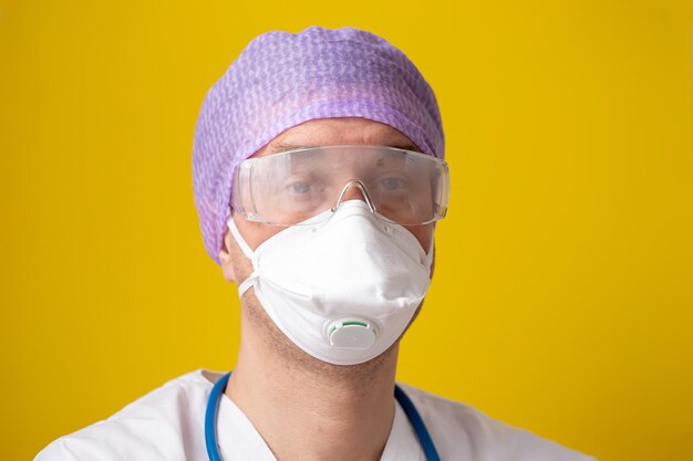 Portrait of man wearing hat against yellow background