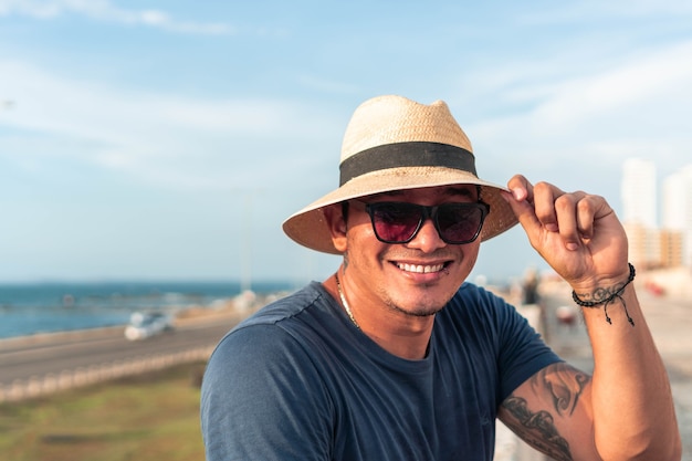 Portrait of a man wearing a hat in the open air