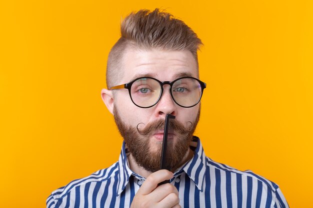 Portrait of man wearing mask against gray background