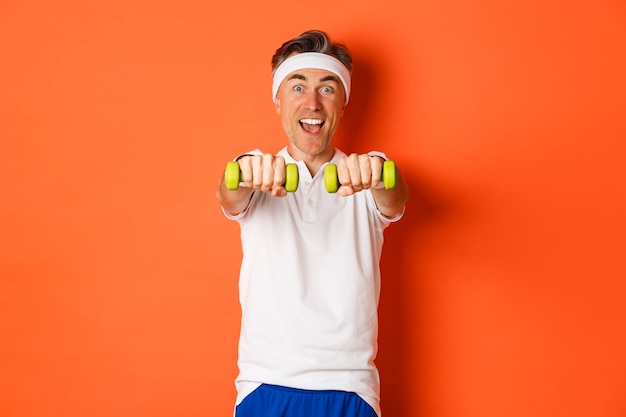 Portrait of man wearing mask against white background