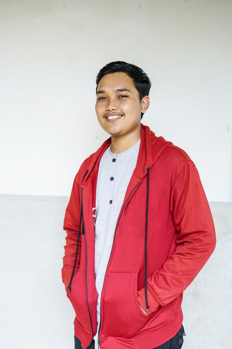 Portrait of a man wearing a red jacket