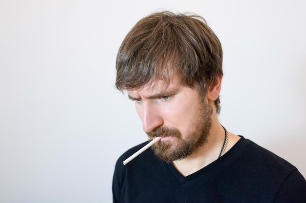 Portrait of a man with a cigarette in the office of a psychologist Psychology psychotherapy