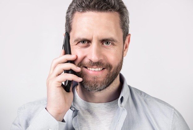 portrait of man with communication call in studio communication call of man photo of man having communication call man has communication call on phone isolated on studio background