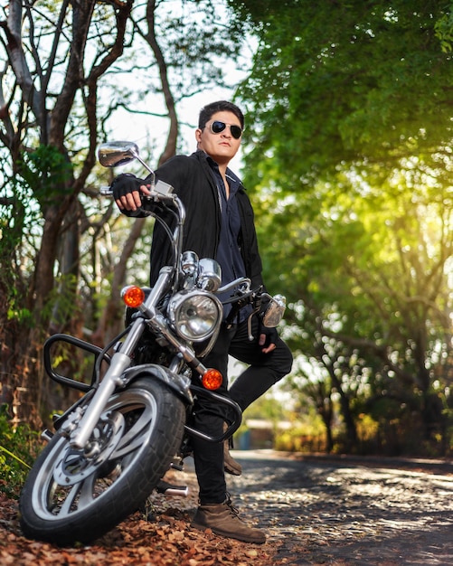 Portrait of a man with his motorcycle Outdoor portrait