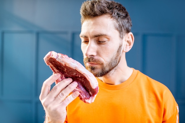 Portrait of a man with meat steak