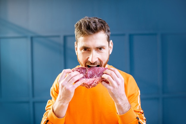 Portrait of a man with meat steak