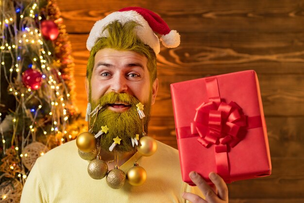 Portrait of a man with ornaments in beard