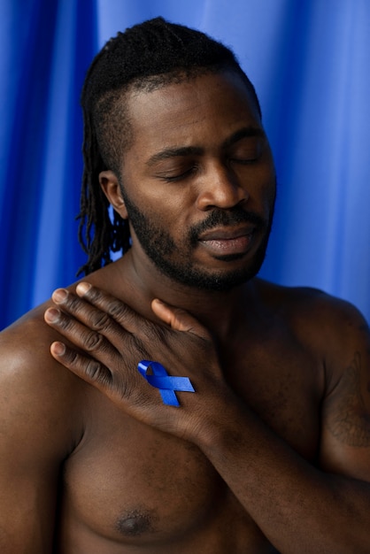 Photo portrait of man with prostate cancer ribbon