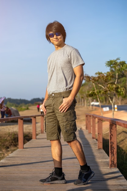 portrait man with sunglasses in nature