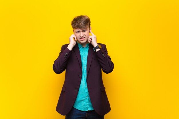 Portrait of a man on a yellow background