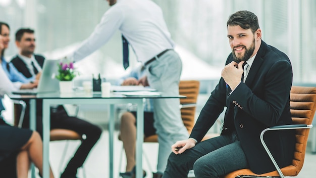 Portrait of manager on the background of business team working i