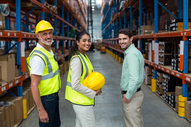 Portrait of manager and workers are standing and smiling to the camera