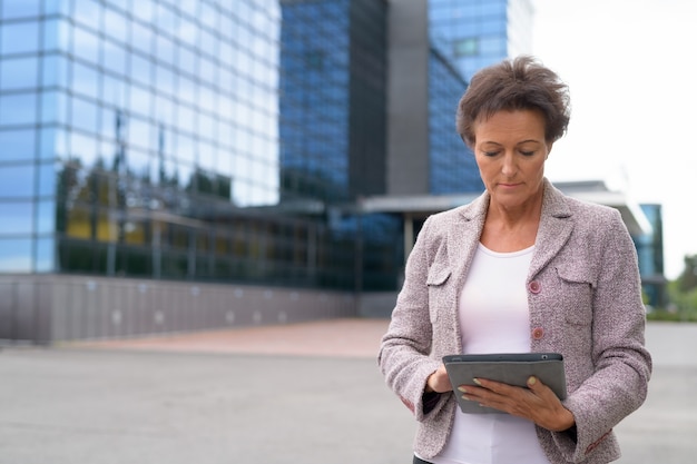 Portrait of mature beautiful businesswoman in the city outdoors