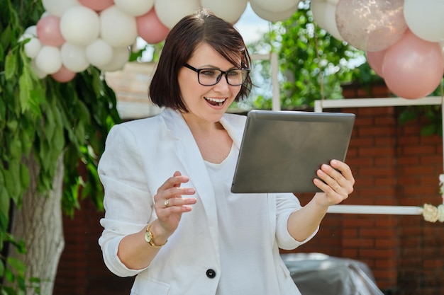 Portrait of mature business woman small business owner organizing events parties weddings