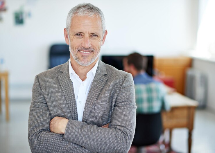 Photo portrait mature businessman and arms crossed in office for pride management and career executive male person and trader with smile in workplace for financial growth enterprise and ceo position