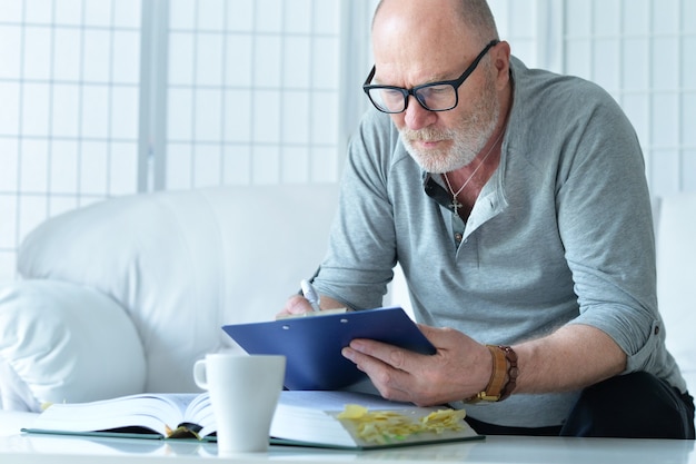 Portrait of a mature businessman at home