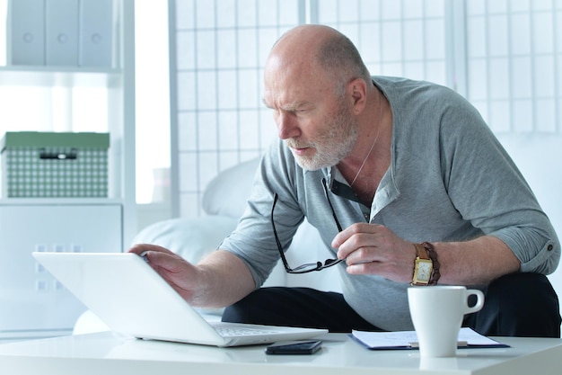 Portrait of a mature businessman at home