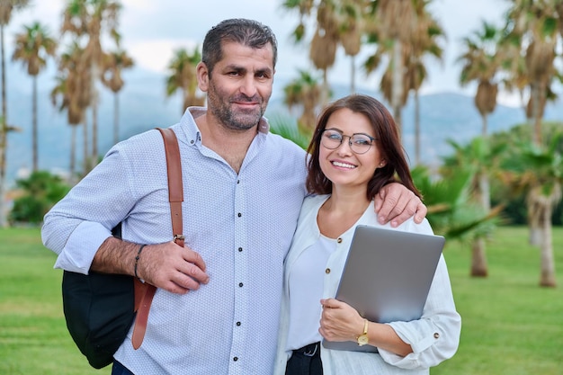 Portrait of mature couple smiling man and woman looking at camera