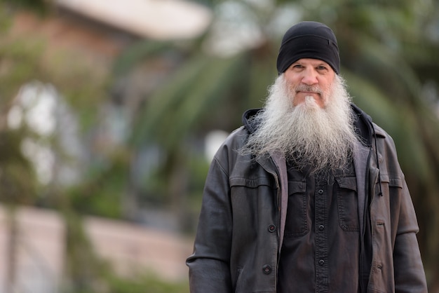 Portrait of mature handsome bearded hipster man