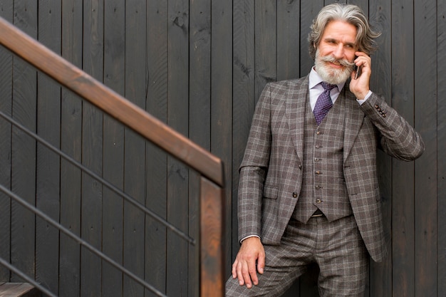 Portrait of mature male talking on the phone