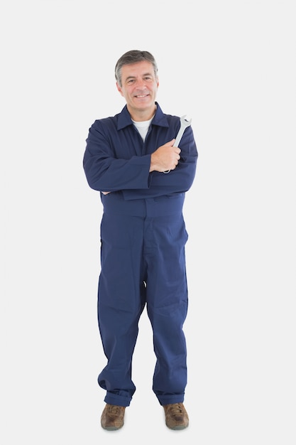 Portrait of mature mechanic with wrench