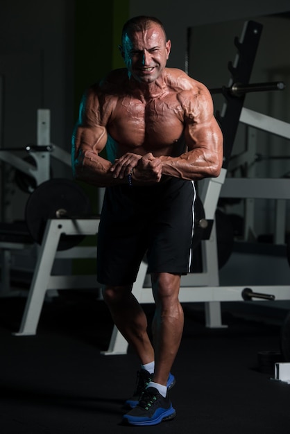 Portrait Of A Mature Physically Fit Man Showing His Well Trained Body  Muscular Athletic Bodybuilder Fitness Male Posing After Exercises