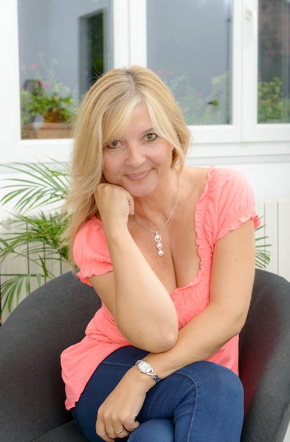 Portrait of mature smiling blond woman