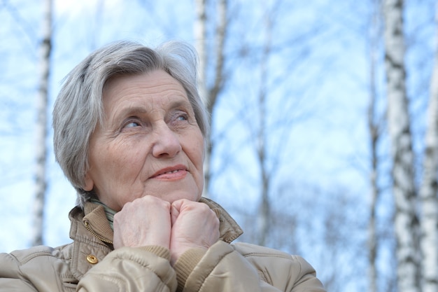 Portrait of a mature woman out for a walk in nature in spring