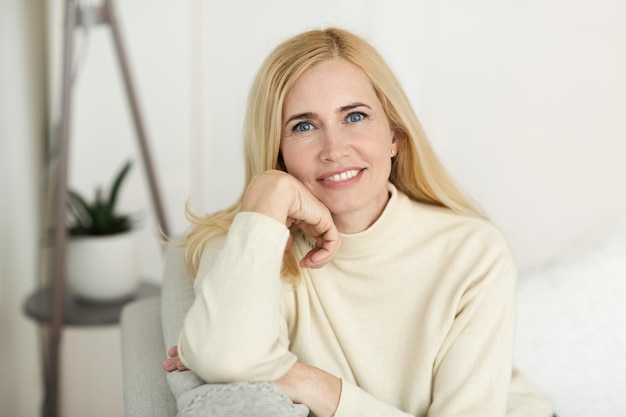 Portrait Of Mature Woman Smiling At Camera At Home