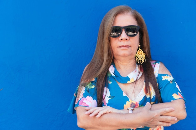 Portrait of a mature woman wearing sunglasses.