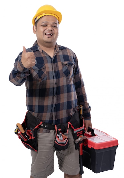 Portrait of a mechanic holding a tool box