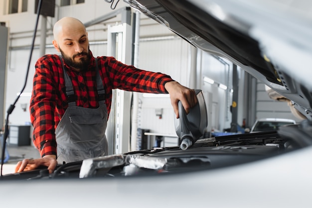 Portrait of a mechanic at work in his garage