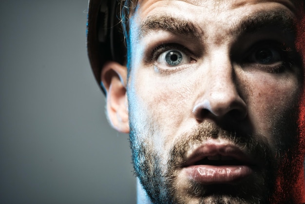 Portrait of mechanical worker close up engineers working builder in protective clothing and helmet