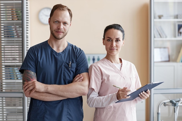 Portrait of medical specialists looking at camera while working in team in hospital