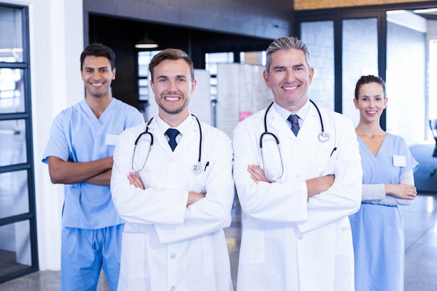 Portrait of medical team standing together and smiling in hospital