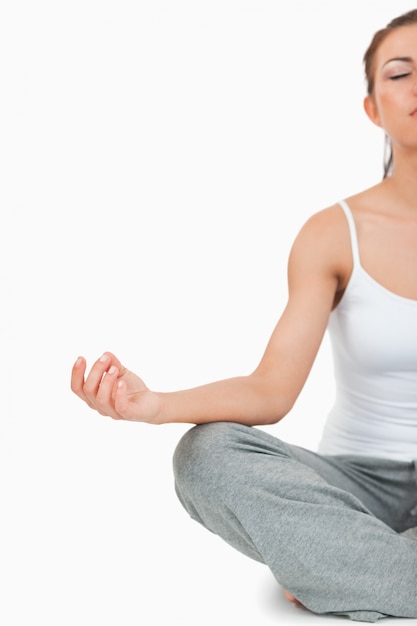 Portrait of a meditating woman in the Sukhasana position