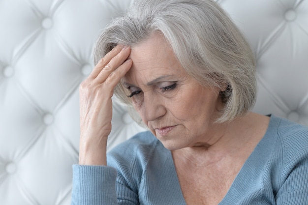 Portrait of a melancholy senior woman close up