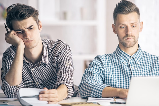 Portrait of men working on project