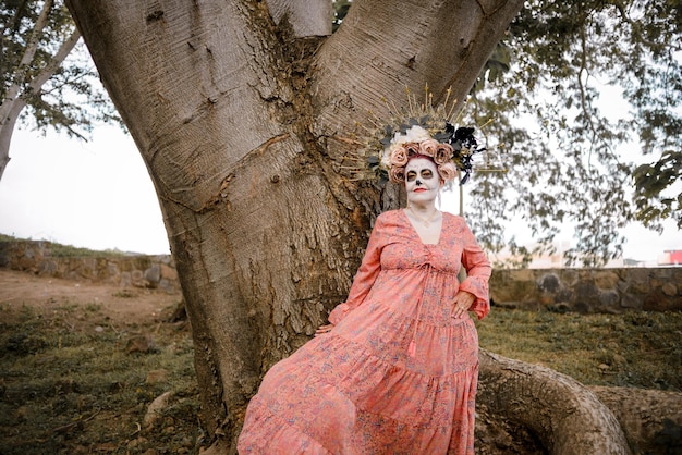 Photo portrait of mexican woman made up as a catrina