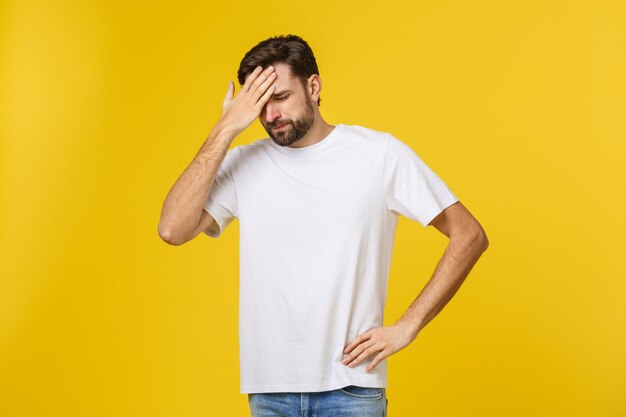 Portrait of mid adult man against yellow background