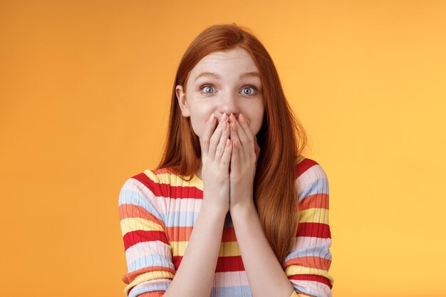 Portrait of mid adult woman against yellow background