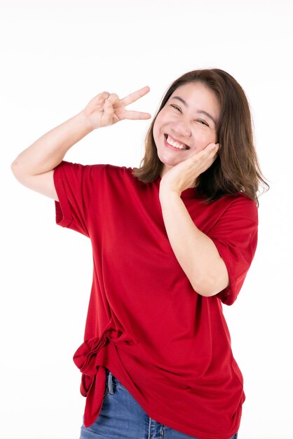 Photo portrait of middle age 40s asian woman woman smiling happily and symbol of victory .isolated on white