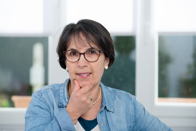 Portrait of middle age brunette with glasses