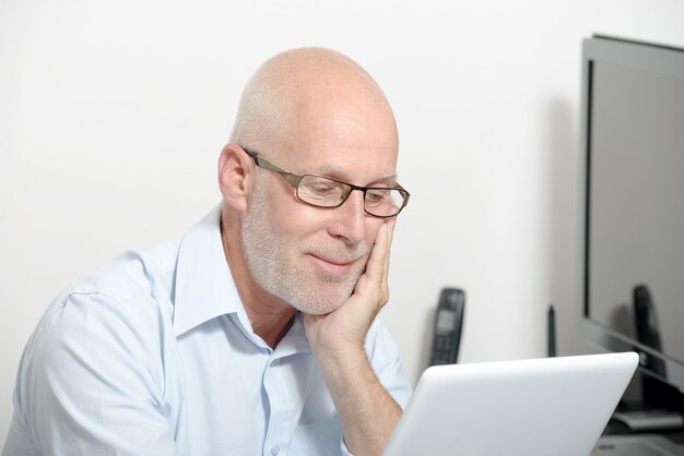 Portrait of a middle-aged man with a digital tablet