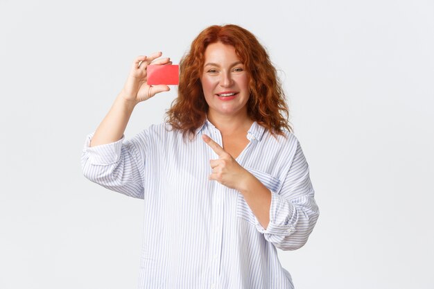 Portrait of middle aged redhead woman posing